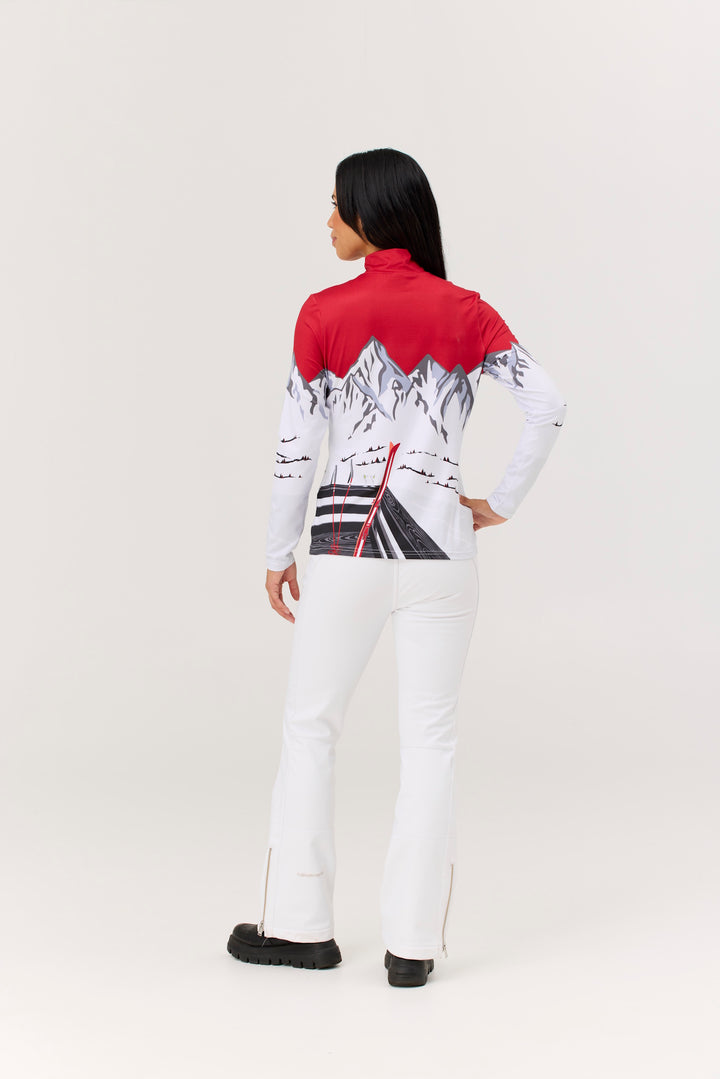 Person wearing a red and white outfit with mountain design on a plain background