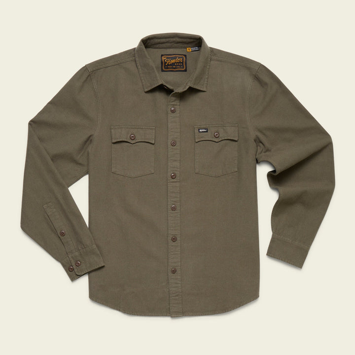 Olive green shirt with button details on a beige background