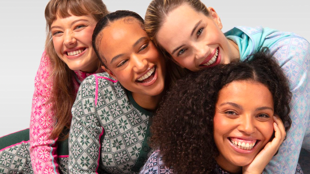 Four women smiling and wearing Kari Traa base layers 