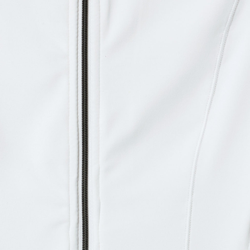 Close-up of a white jacket with a zipper on a light gray background