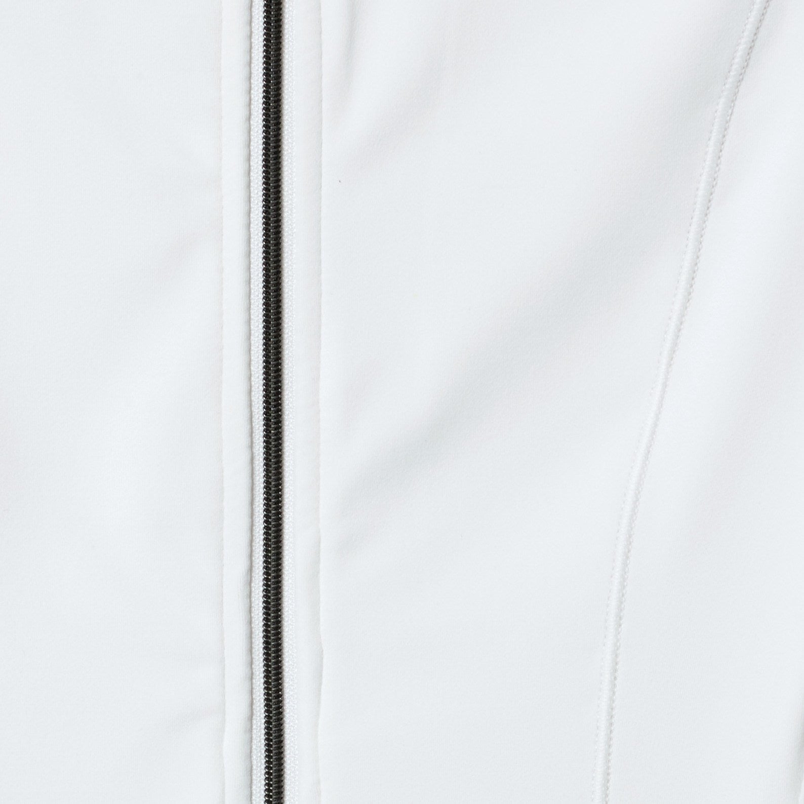 Close-up of a white jacket with a zipper on a light gray background