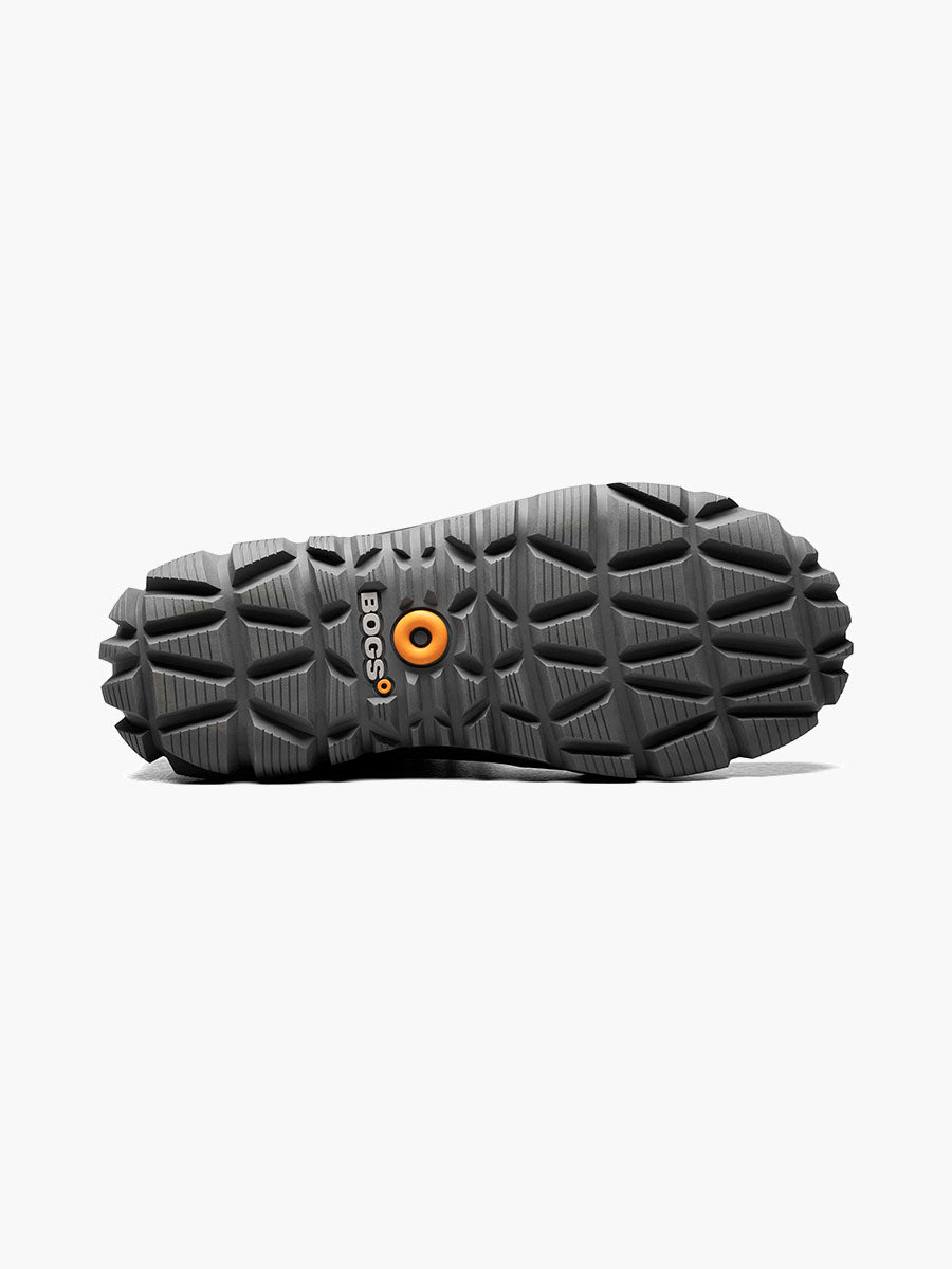 Close-up of a black shoe sole with a brand logo on a white background