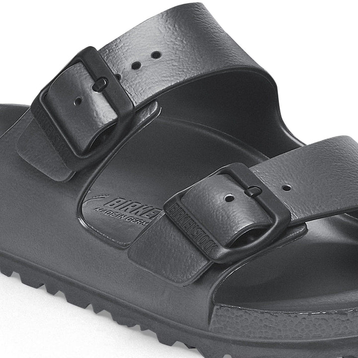 Black sandal with two straps on a white background