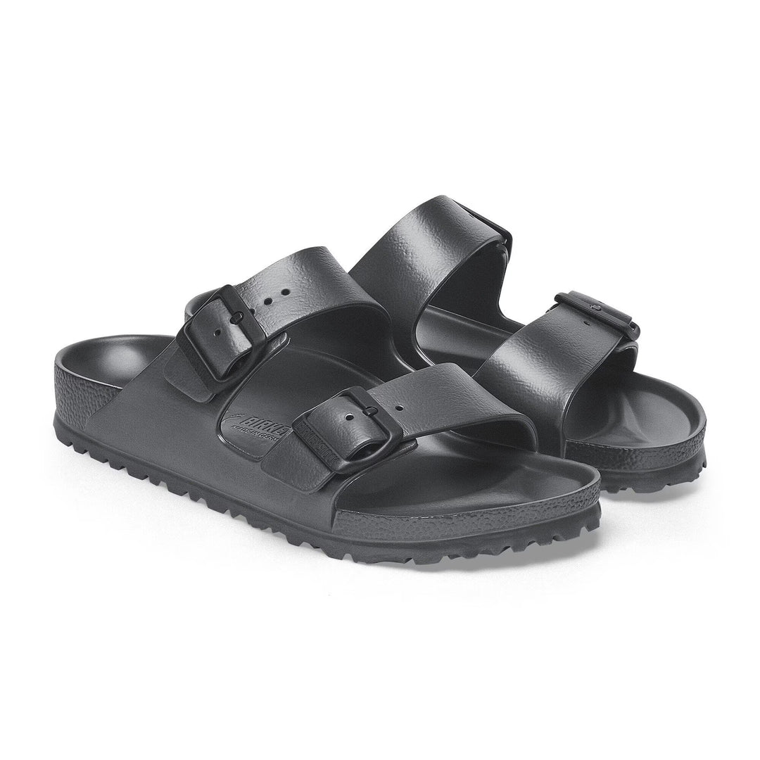 Black sandals with two straps on a white background