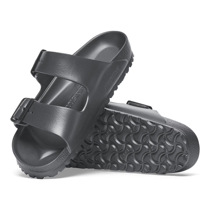 Black sandal with a strap on a white background