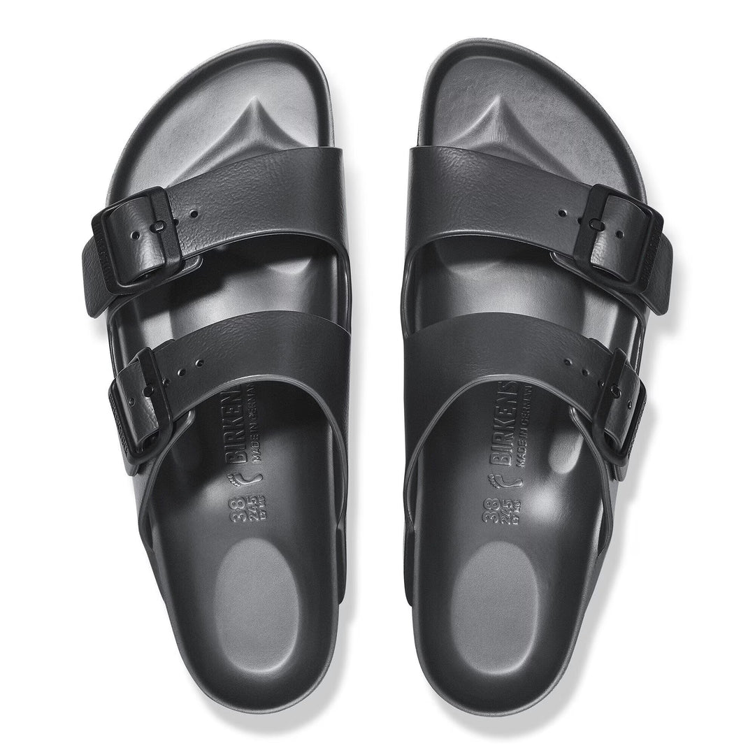 Black sandals with double buckles on a white background