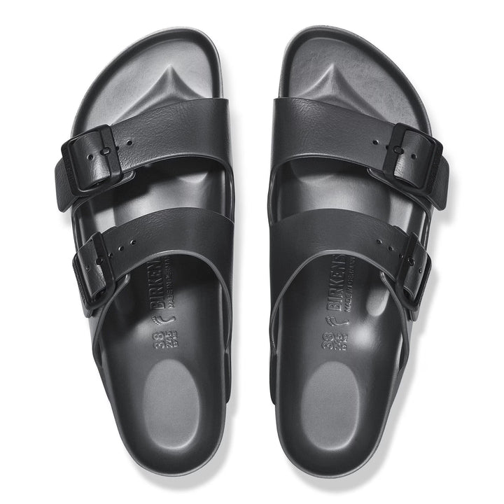 Black sandals with double buckles on a white background