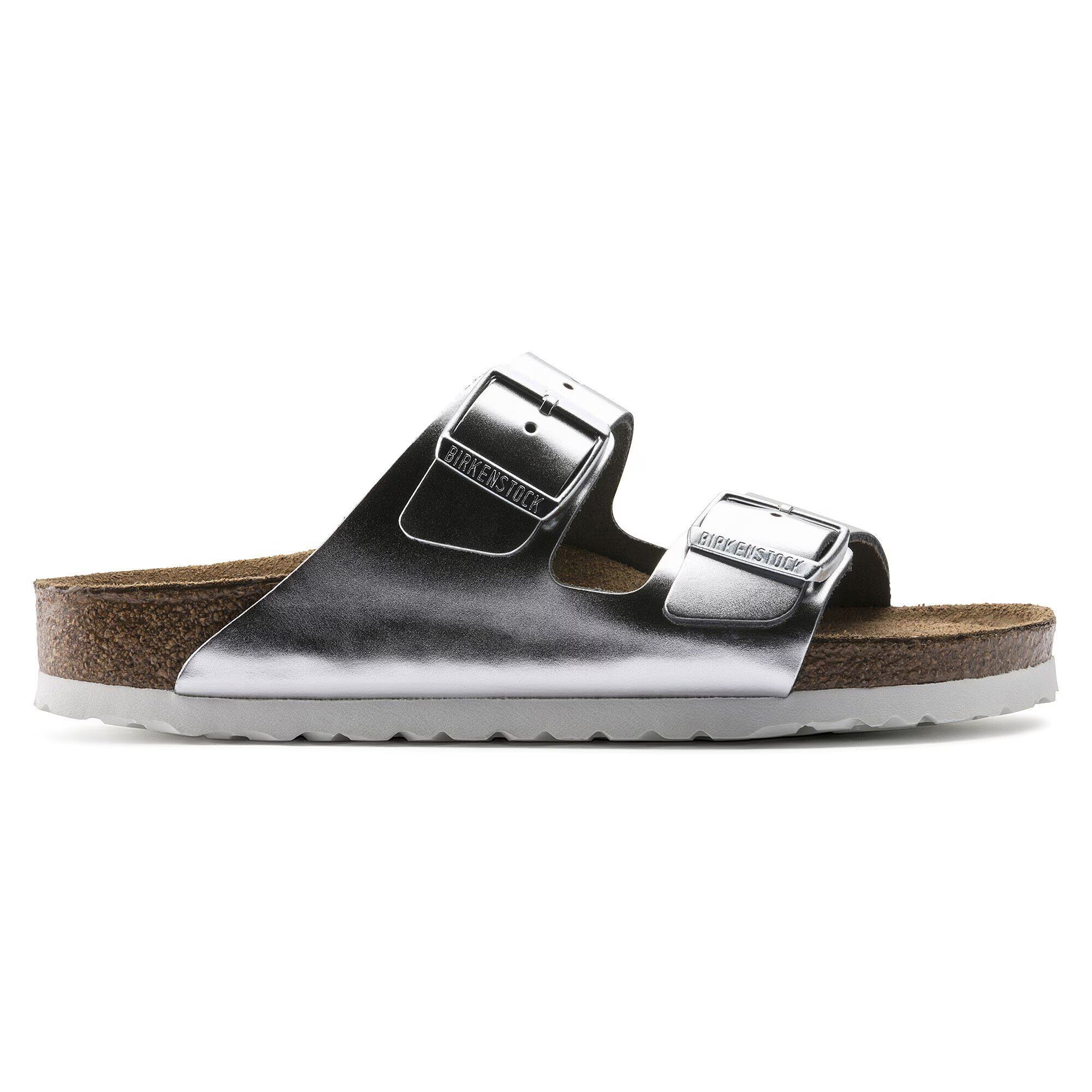 Silver sandal with cork sole on a white background