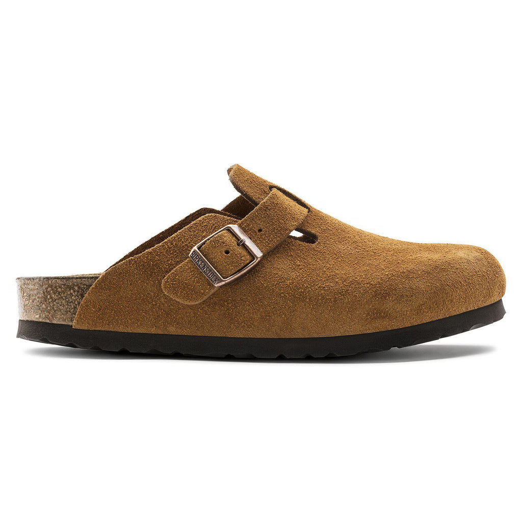 Brown suede clog with a buckle on a white background