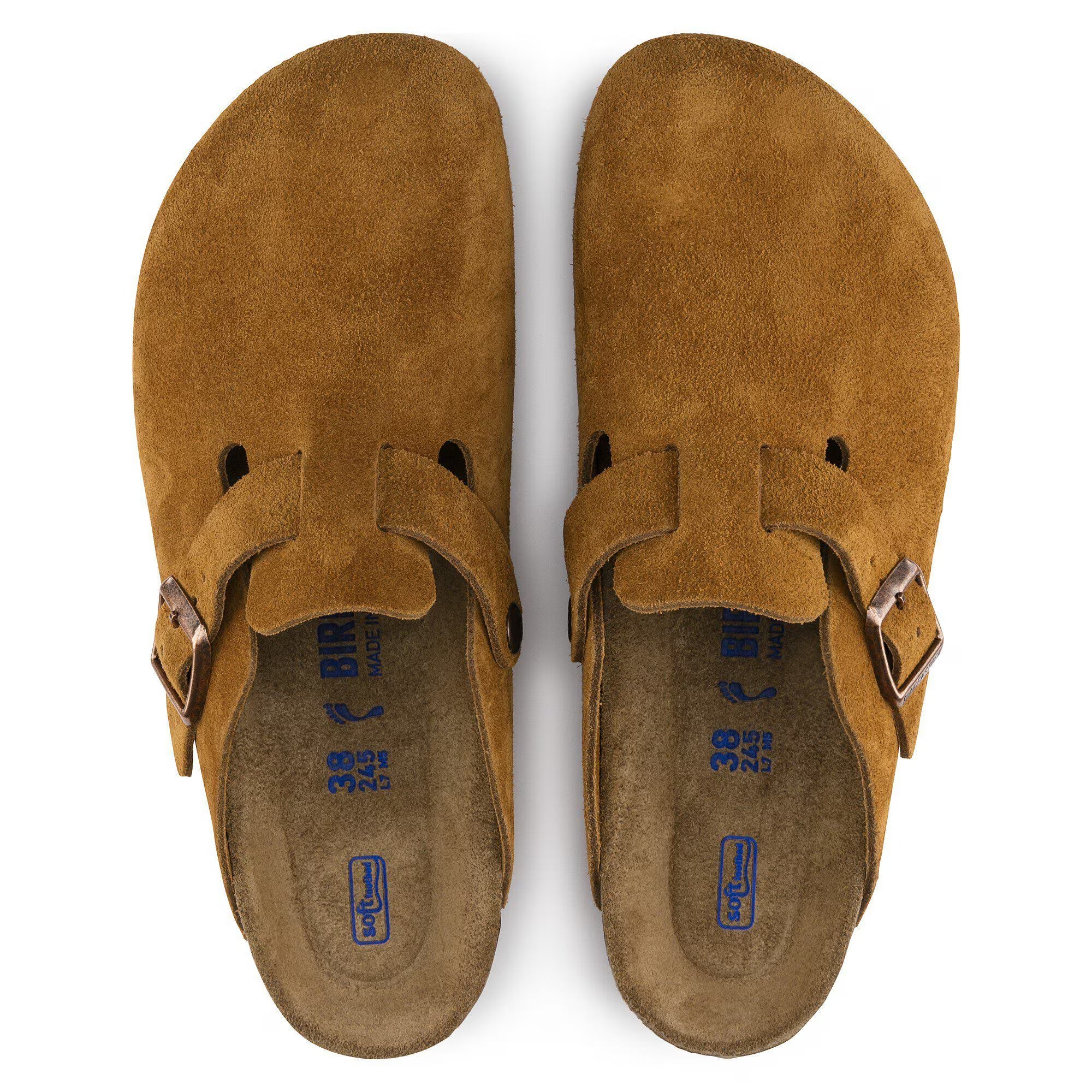 Pair of Brown suede clogs with a buckle on a white background
