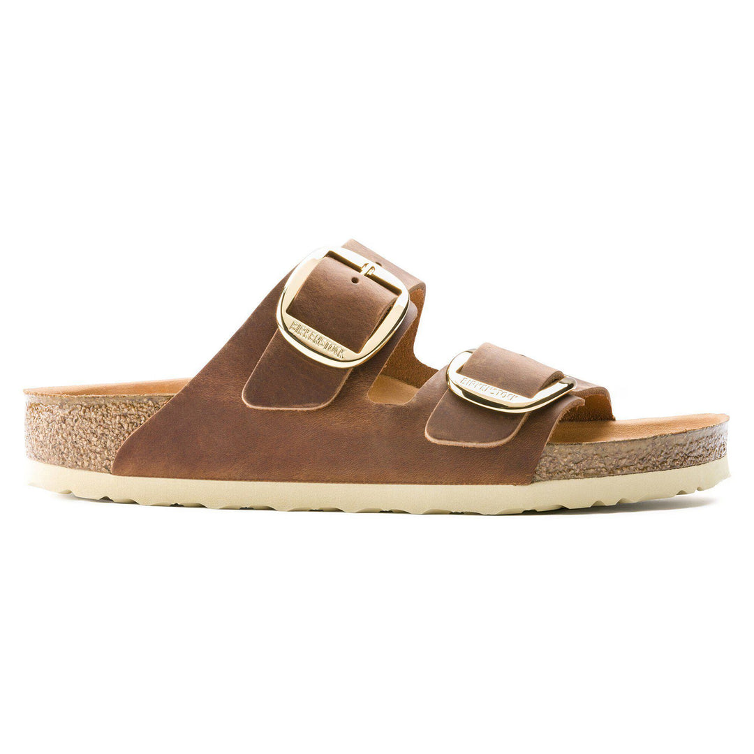 Brown sandal with cork sole on a white background