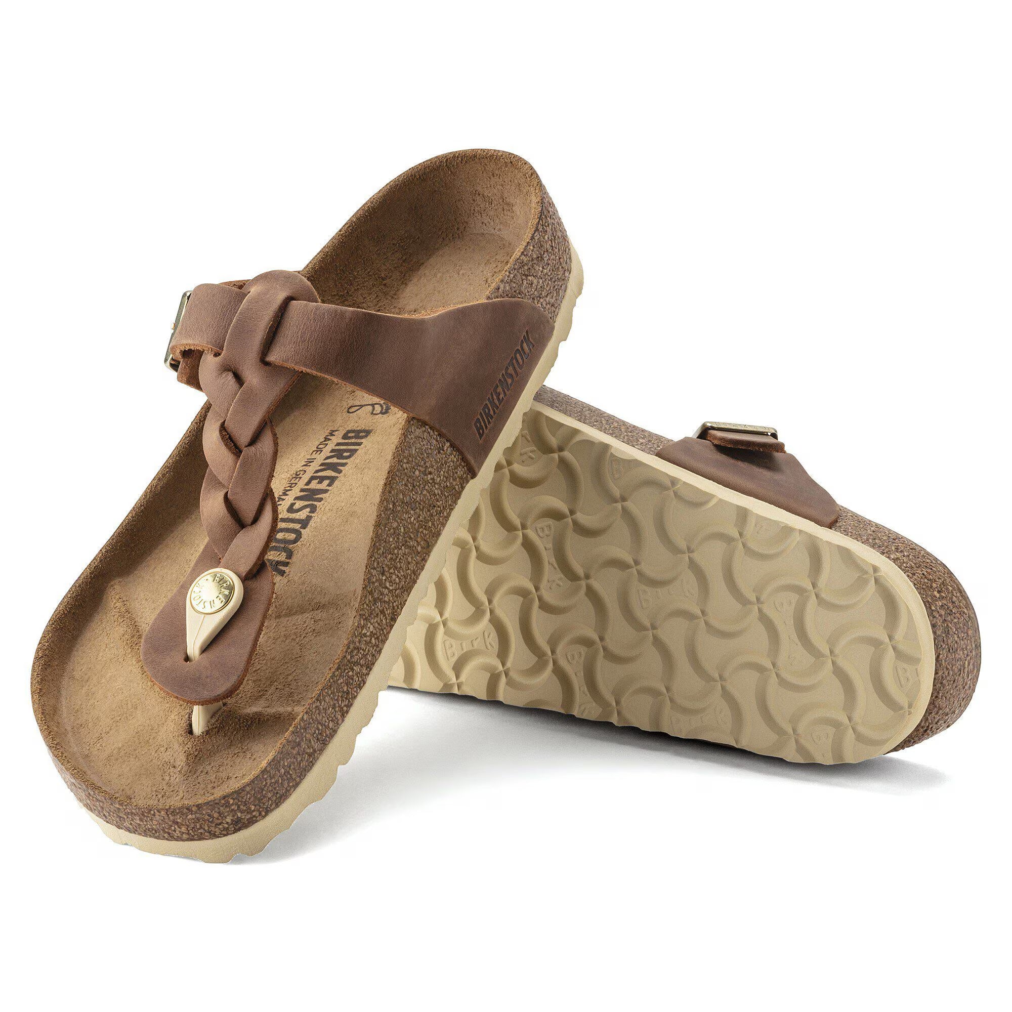 Brown sandals with a strap on a white background