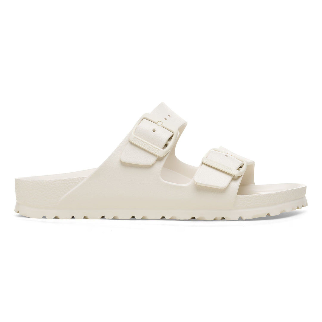 White sandal with two buckles on a white background