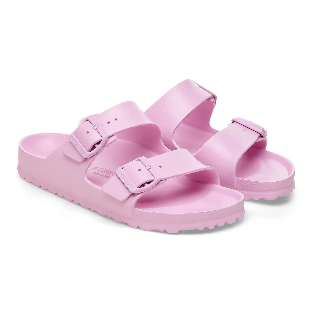 Pink sandals with double straps on a white background