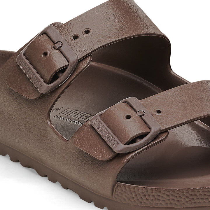 Brown sandal with double buckle strap on a white background
