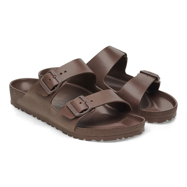 Pair of brown sandals on a white background