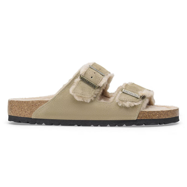 Beige sandal with shearling lining on a white background