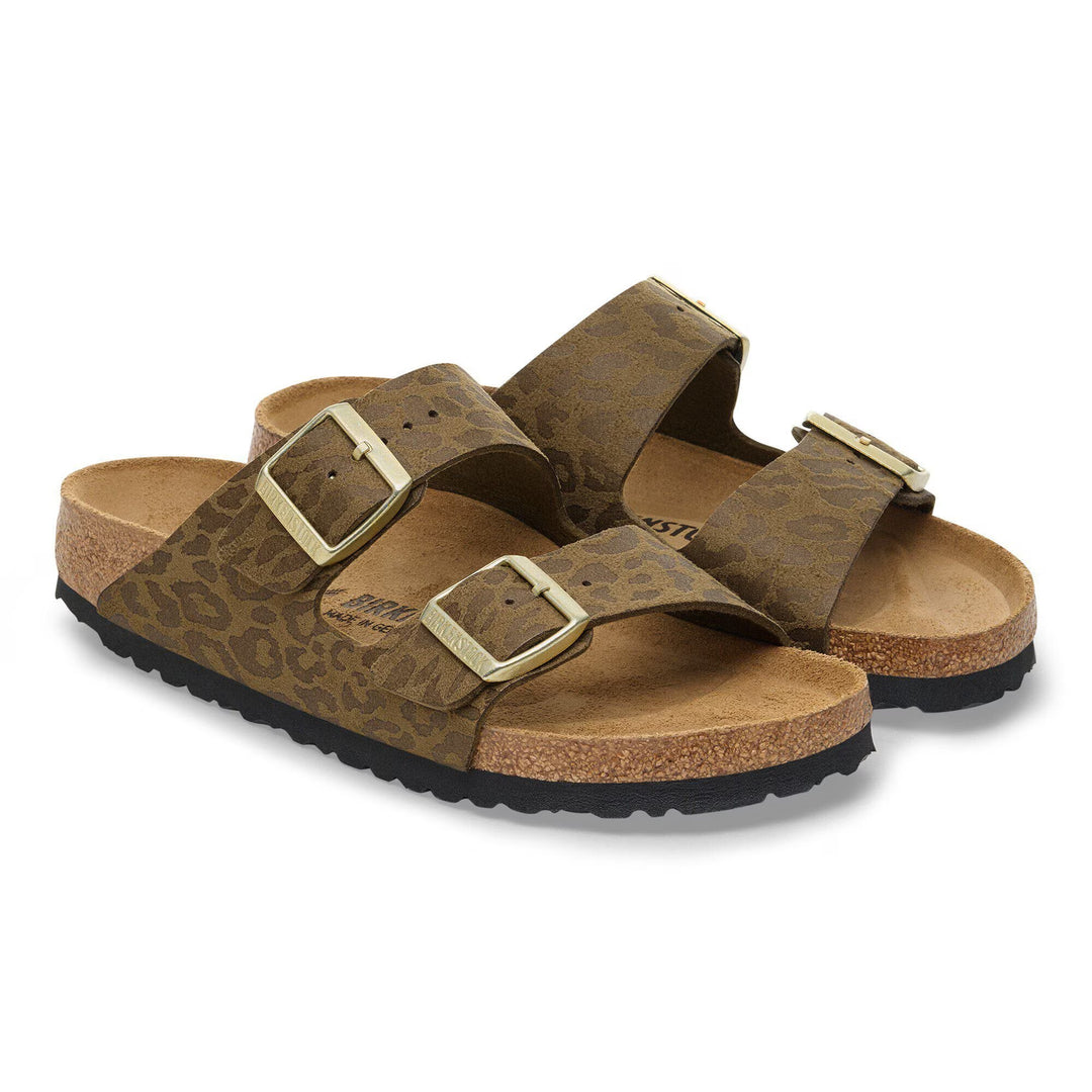 Pair of brown sandals with gold buckles on a white background