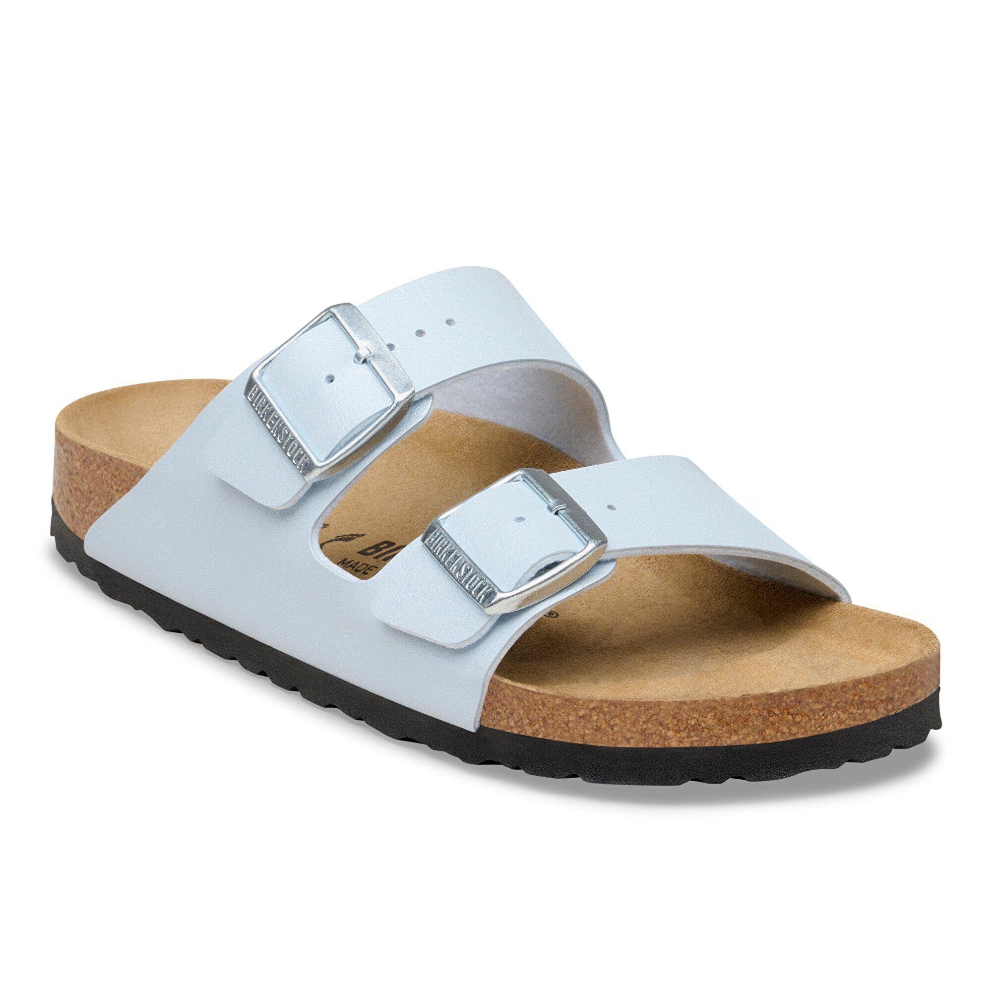 White sandal with cork sole on a white background