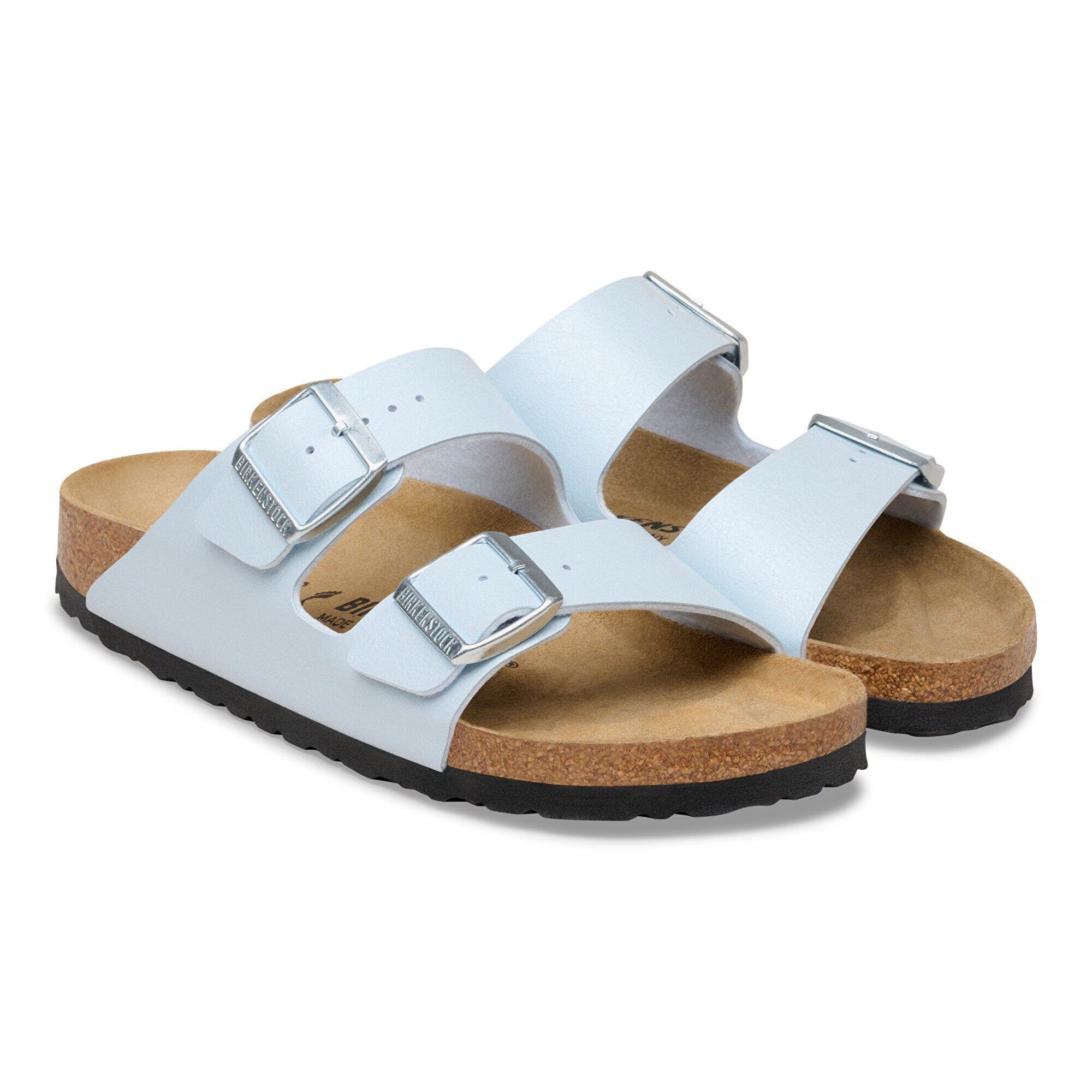 White sandals with cork sole on a white background