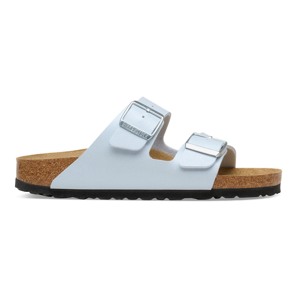 White sandal with cork sole on a white background