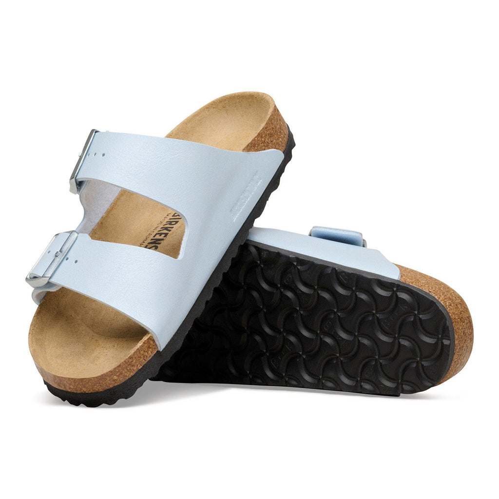 White sandals with cork sole on a white background