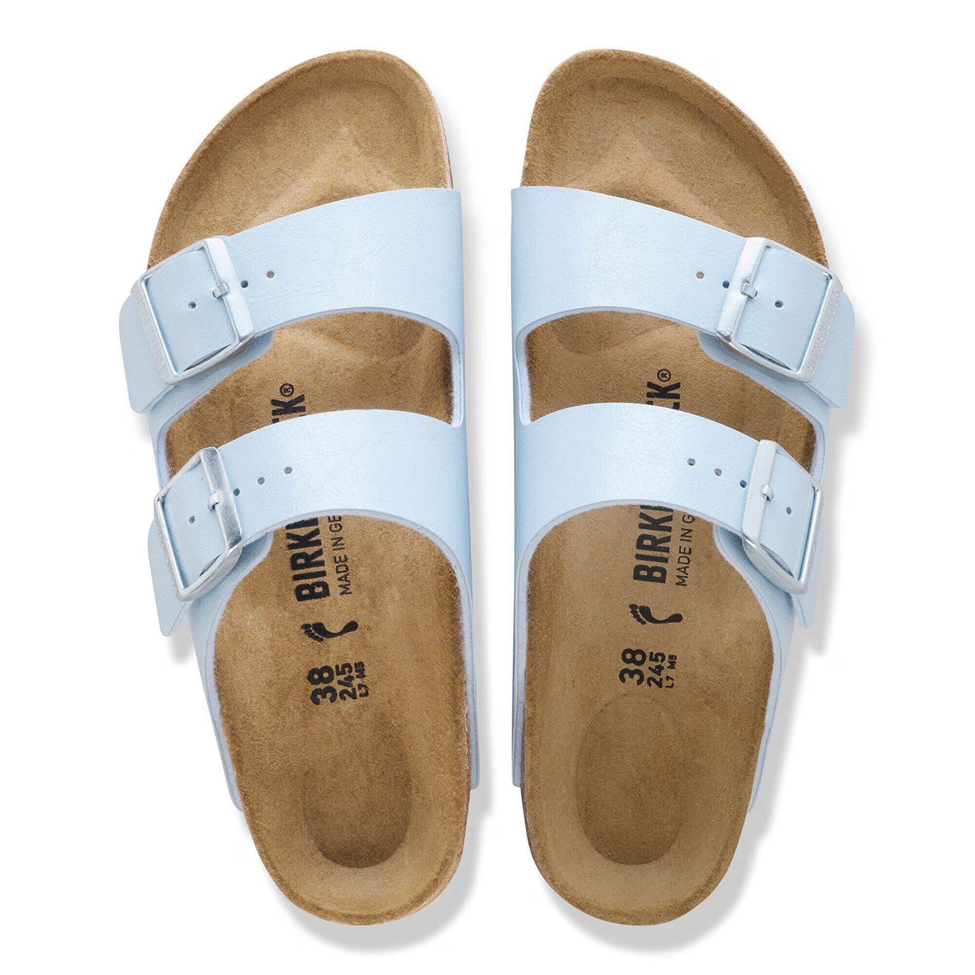 Pair of light blue Birkenstock sandals with brown soles on a white background