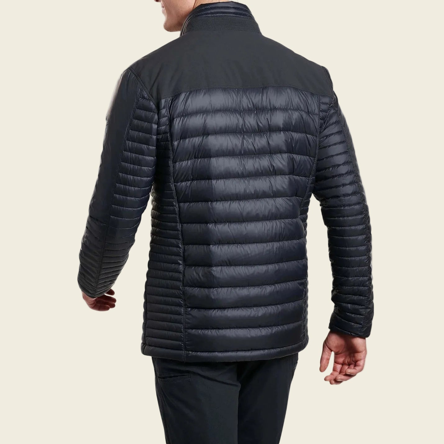 Man wearing a black puffer jacket on a white background
