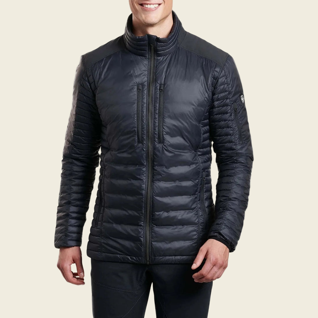 Man wearing a black puffer jacket on a white background