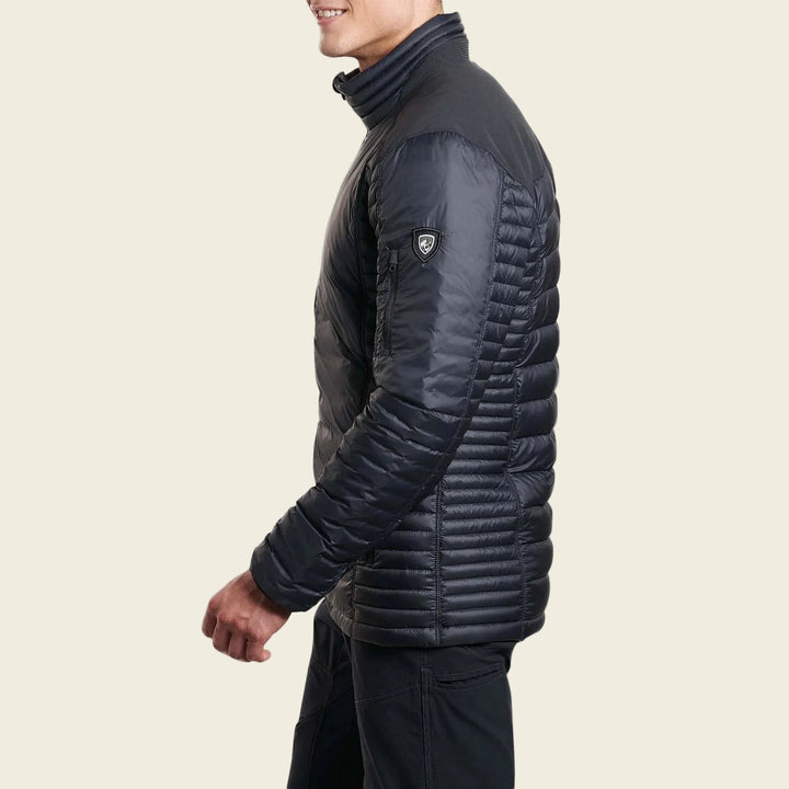 Man wearing a black quilted jacket on a white background
