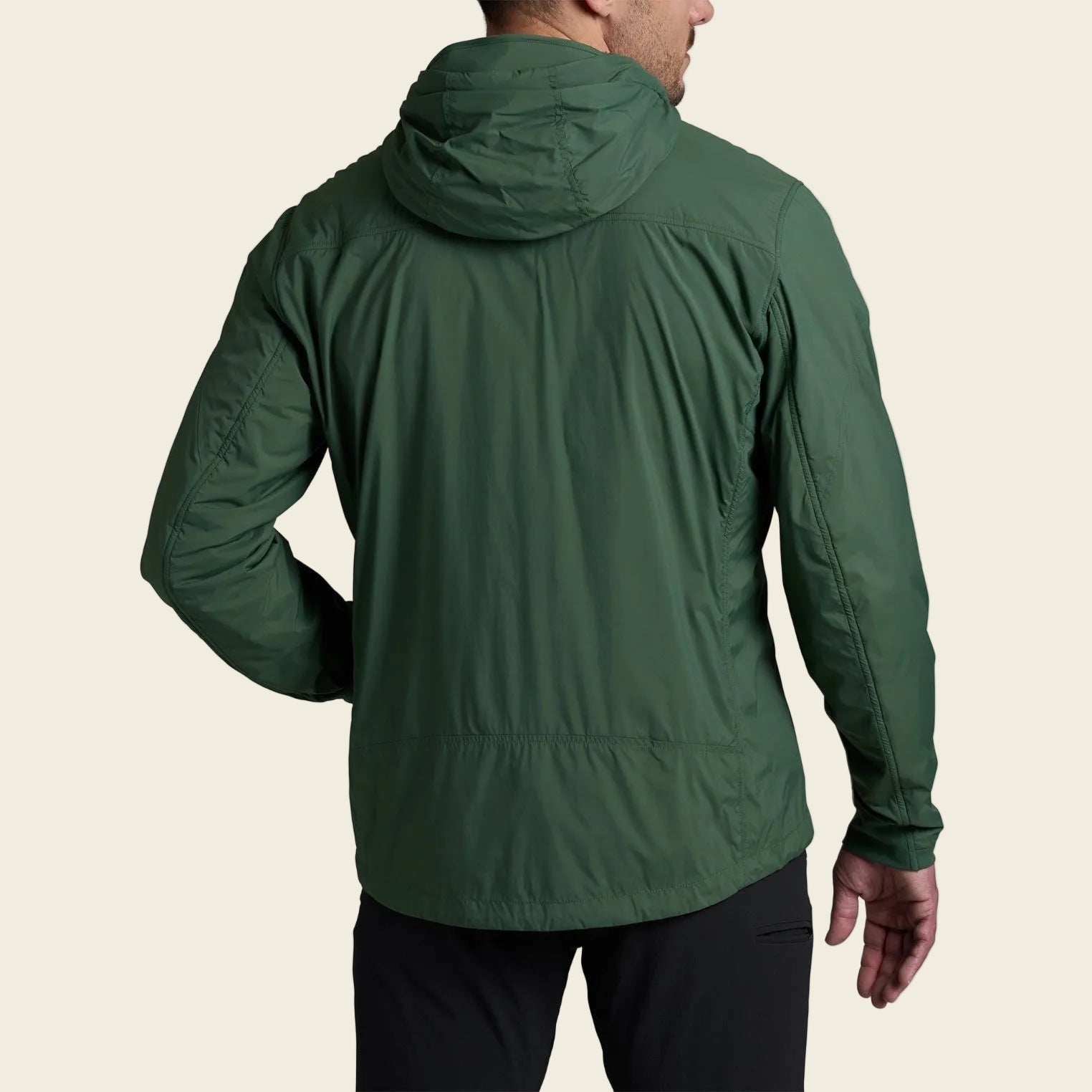 Green jacket worn by a person on a white background