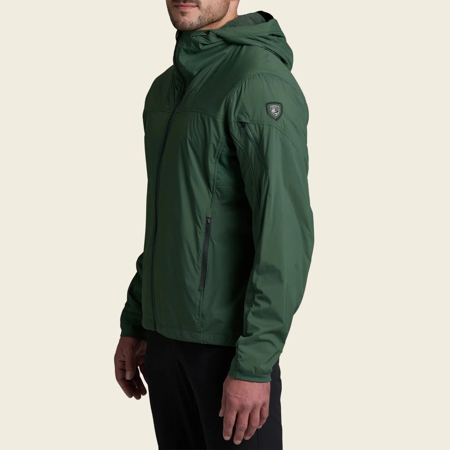 Green jacket worn by a person on a white background