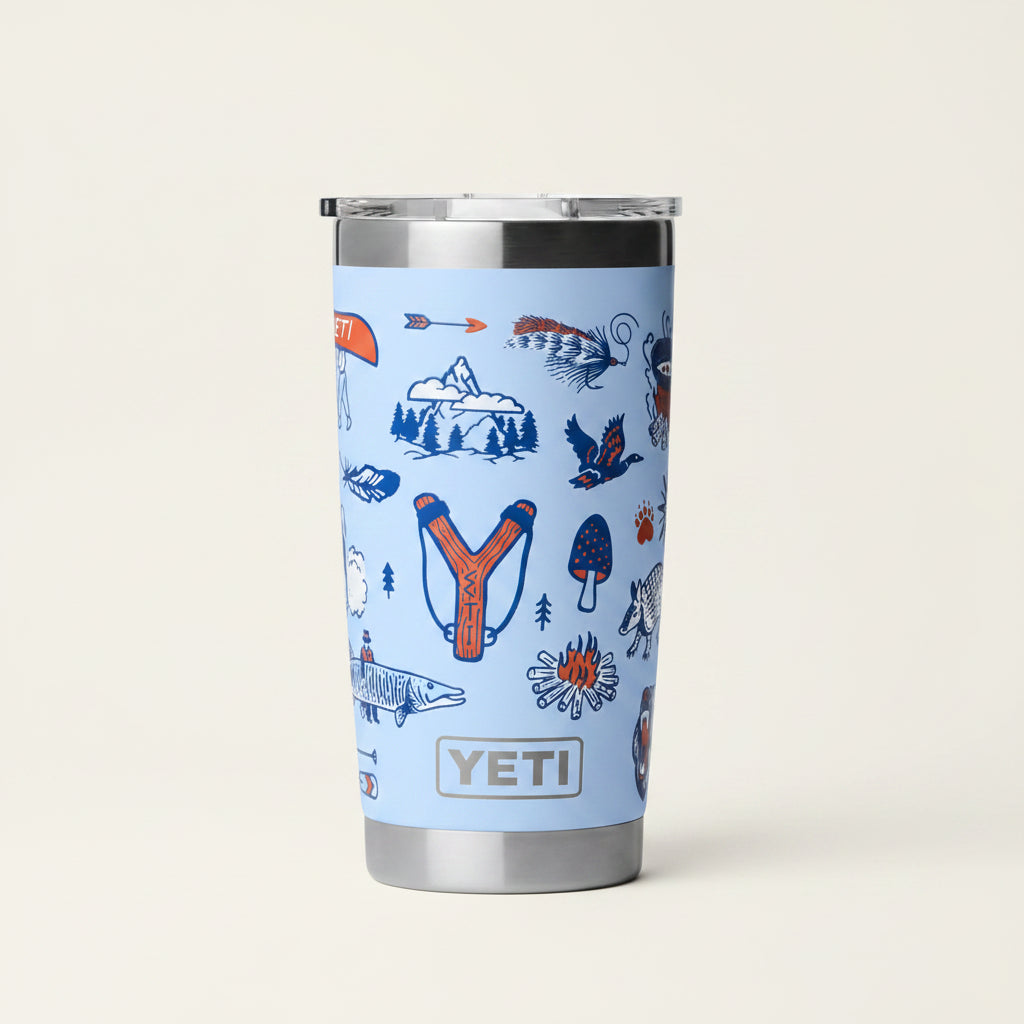 YETI tumbler with nature-themed design on a light blue background