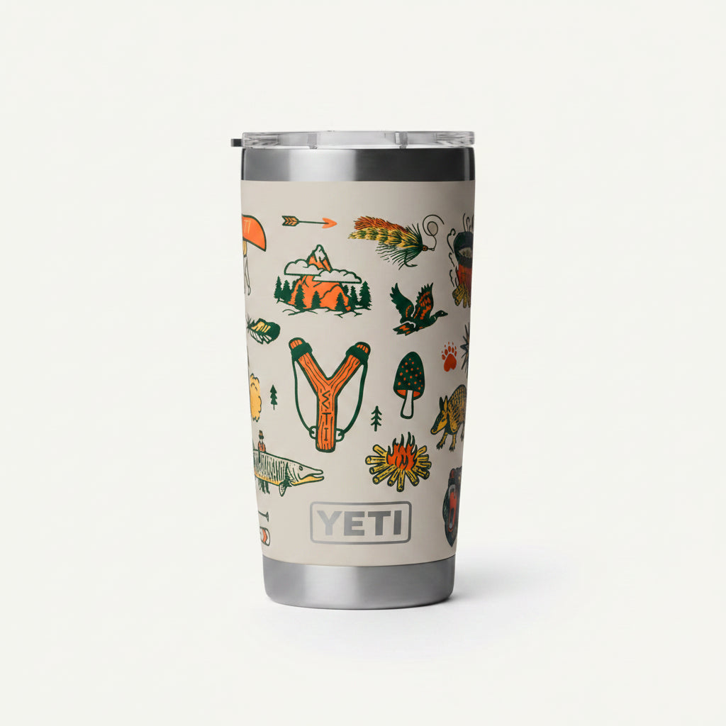YETI tumbler with outdoor-themed design and visible YETI logo.