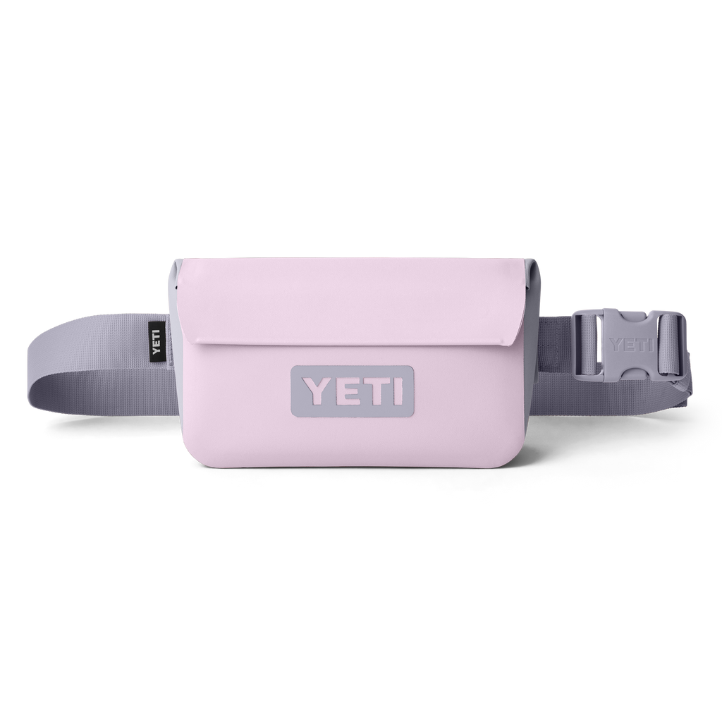 Pink YETI waist bag with a gray strap on a white background