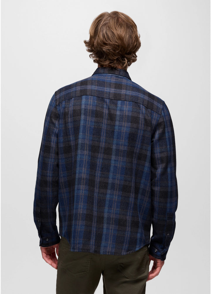 Person wearing a blue plaid shirt on a white background