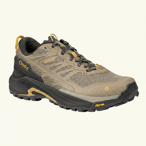 Brown hiking shoe with black and yellow accents on a white background