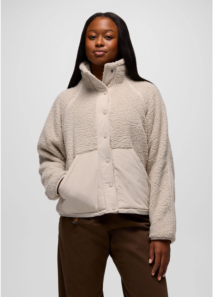 Woman wearing a beige prAna Encinitas Fleece Jacket against a white background
