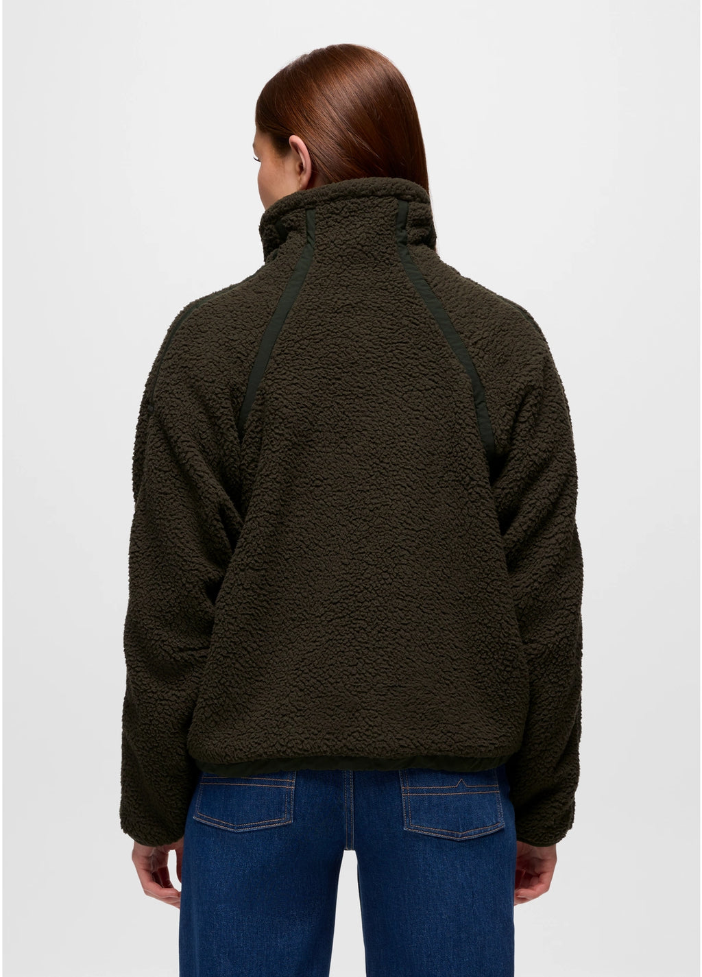 Person wearing a dark green prAna Encinitas Fleece Jacket and blue jeans on a white background