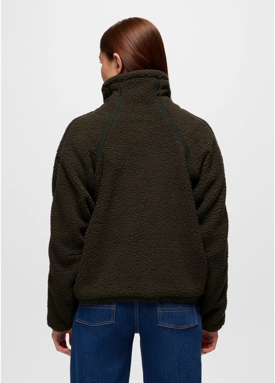 Person wearing a dark green prAna Encinitas Fleece Jacket and blue jeans on a white background