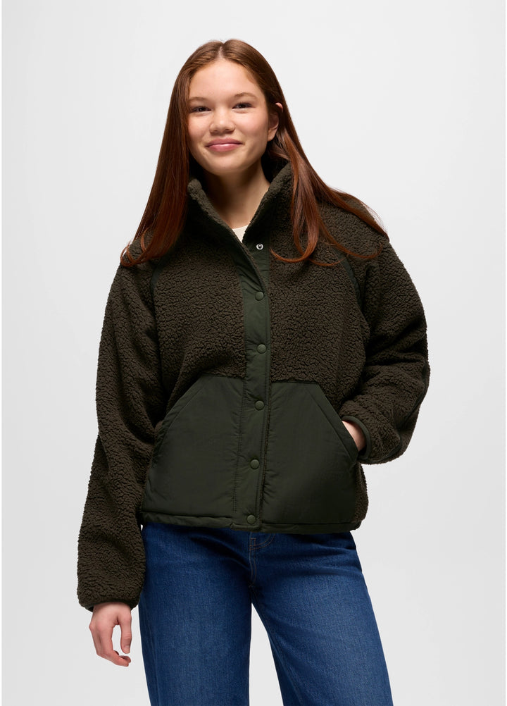 Person wearing a dark green prAna Encinitas Fleece Jacket and blue jeans on a white background