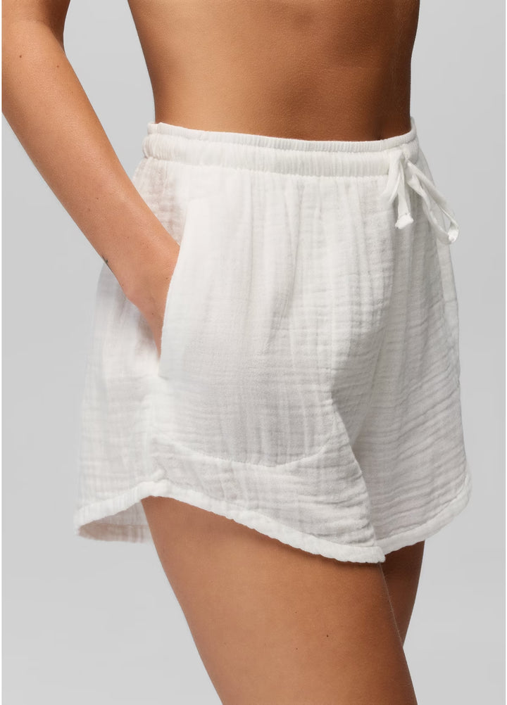 White shorts worn by a person on a plain background