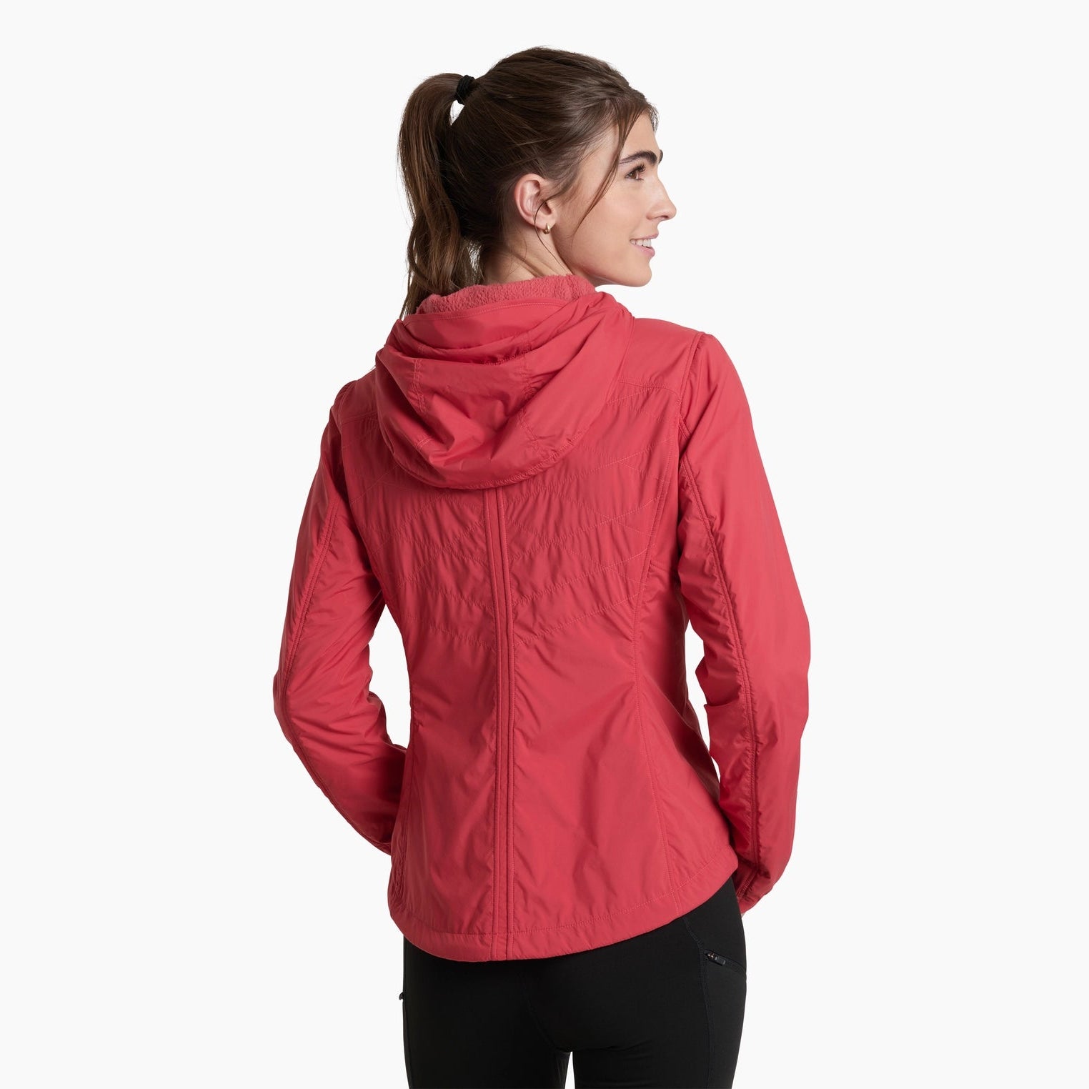 Woman wearing a red jacket on a white background