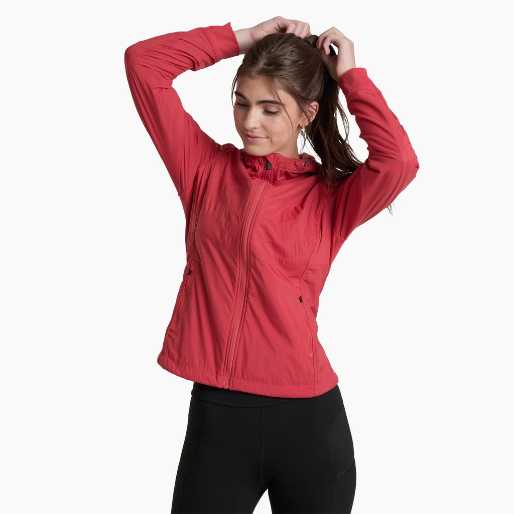 Woman wearing a red jacket on a white background