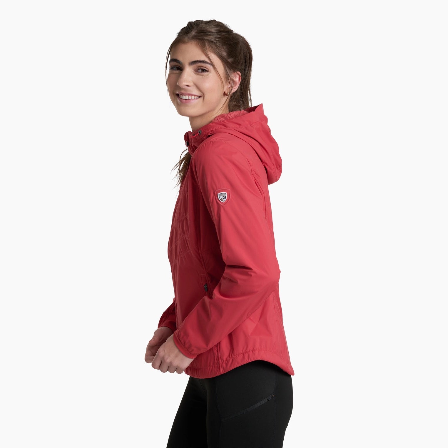 Woman wearing a red jacket on a white background