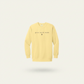 A pale yellow crewneck sweatshirt with 'great north woods' printed in black across the chest, displayed against a solid white background.
