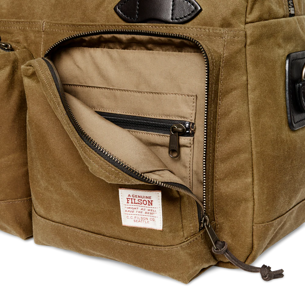 Brown duffel bag with leather straps on a white background