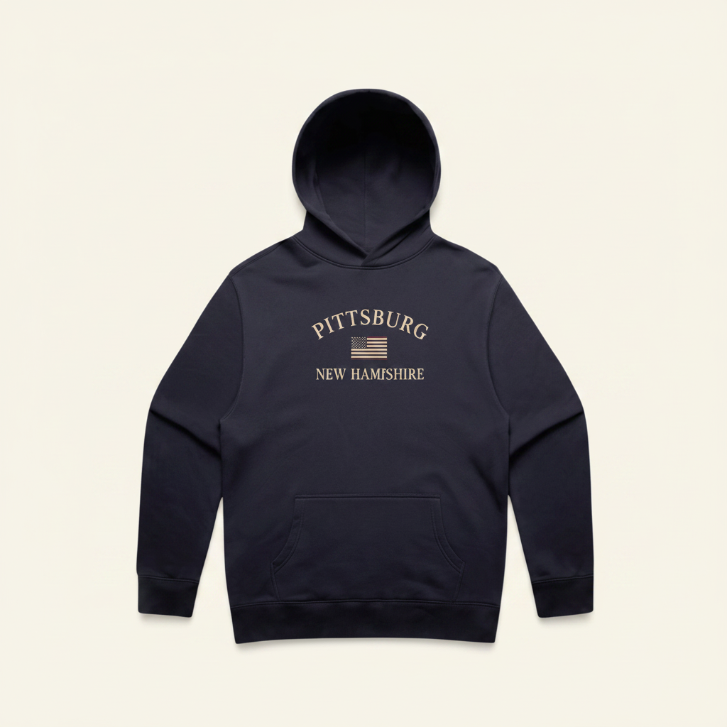 A dark navy blue pullover hoodie with a front kangaroo pocket and a distressed white graphic on the chest reading 'PITTSBURG NEW HAMPSHIRE' with a small American flag, shown against a plain white background.