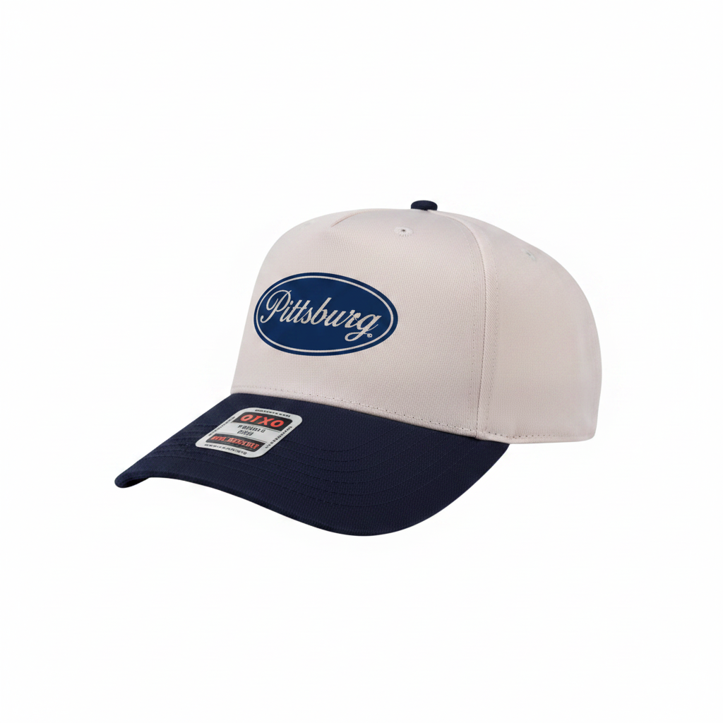 A baseball cap with a white front panel, a navy blue visor, and a navy blue oval logo patch on the front that reads 'Pittsberg'.