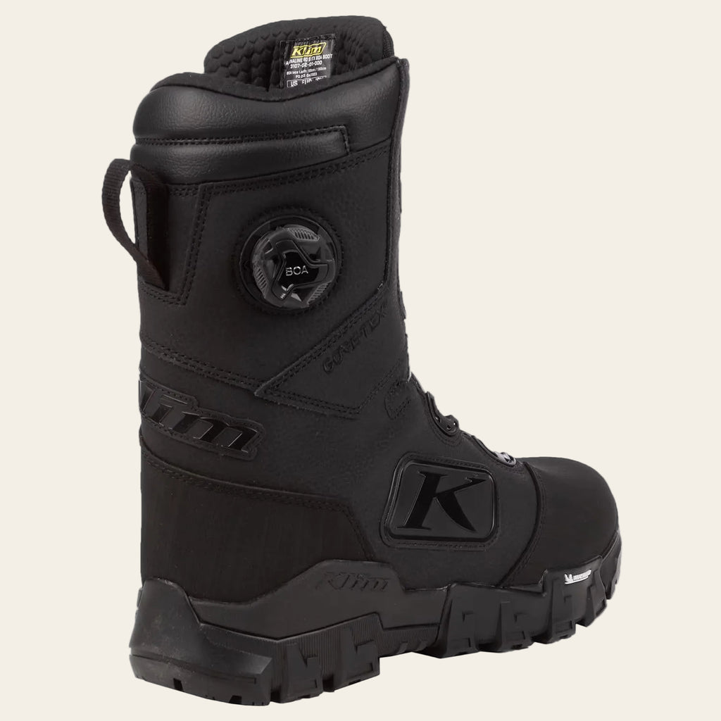 A black K2B tactical boot with a dial closure system on the side, shown from a three-quarters angle against a plain white background.